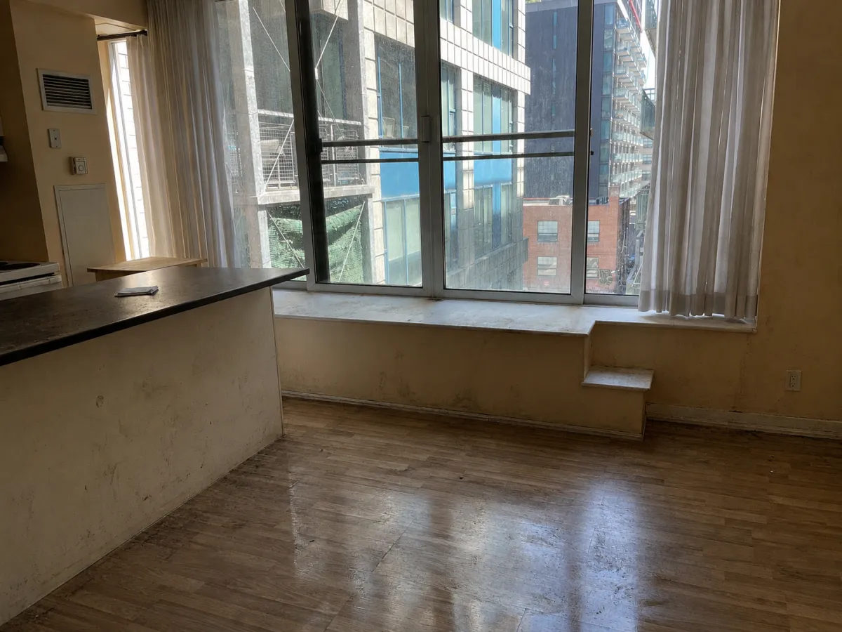 Condo living area before move-out cleaning